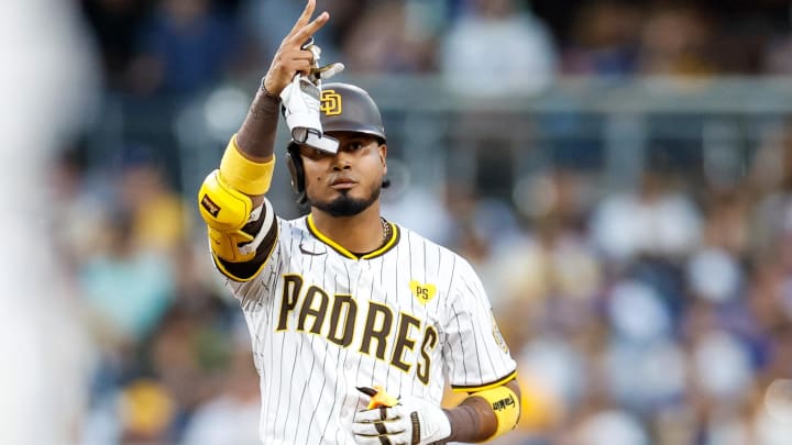 Jul 30, 2024; San Diego, California, USA; San Diego Padres designated hitter Luis Arraez (4) celebrates after hitting a double during the third inning against the Los Angeles Dodgers at Petco Park.