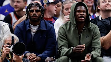 Oct 24, 2023; Denver, Colorado, USA; University of Colorado Buffaloes football players Shedeur Sanders (L) and Travis Hunter (R) watch during the third period between the Denver Nuggets and the Los Angeles Lakers at Ball Arena. Mandatory Credit: Isaiah J. Downing-Imagn Images