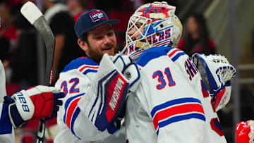 May 16, 2024; Raleigh, North Carolina, USA; New York Rangers goaltender Igor Shesterkin (31) and goaltender Jonathan Quick (32) celebrate their victory against the Carolina Hurricanes in game six of the second round of the 2024 Stanley Cup Playoffs at PNC Arena. Mandatory Credit: James Guillory-Imagn Images