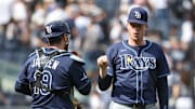 Tampa Bay closer Pete Fairbanks (right) celebrates with catcher Danny Jansen after beating the New York Yankees on Saturday.