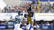 Oct 8, 2017; Los Angeles, CA, USA; Los Angeles Rams wide receiver Cooper Kupp (18) catches a pass in the first quarter as Seattle Seahawks free safety Earl Thomas (29) and cornerback Justin Coleman (28) defend during a NFL football game at Los Angeles Memorial Coliseum. 