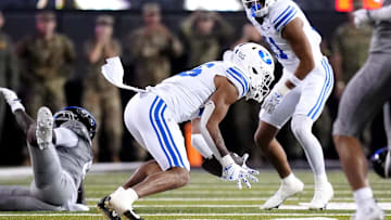 Sep 27, 2025; Boulder, Colorado, USA; Brigham Young Cougars linebacker Isaiah Glasker (16) pulls in an interception in the fourth quarter against the Colorado Buffaloes at Folsom Field. Mandatory Credit: Ron Chenoy-Imagn Images