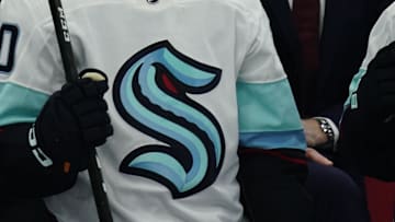 Jan 5, 2023; Toronto, Ontario, CAN; Seattle Kracken forward Eeli Tolvanen (20) and head coach Dave Haskol watch the play against the Toronto Maple Leafs at Scotiabank Arena. Mandatory Credit: John E. Sokolowski-Imagn Images