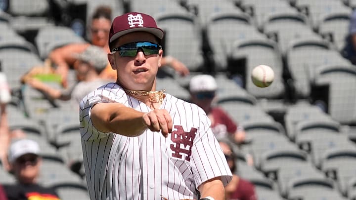 Mississippi State third baseman Ace Reese (3) fields a bunt by Texas A&M second baseman Ben Royo (10) but makes a wild throw to first in the first round of the SEC Baseball Tournament at the Hoover Met. Mississippi State third baseman Ace Reese (3) fields a bunt by Texas A&M second baseman Ben Royo (10) but makes a wild throw to first in the first round of the SEC Baseball Tournament at the Hoover Met.