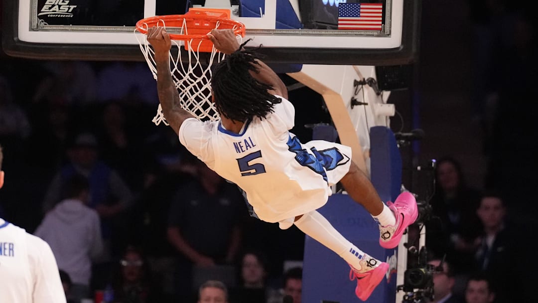 Mar 14, 2025; New York, NY, USA;  Creighton Bluejays guard Jamiya Neal (5) dunks on Connecticut Huskies as time ran out on the Huskies in the second half at Madison Square Garden. Mandatory Credit: Robert Deutsch-Imagn Images
