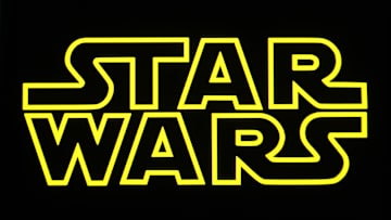 In this photo illustration, a Star Wars logo is seen on a...