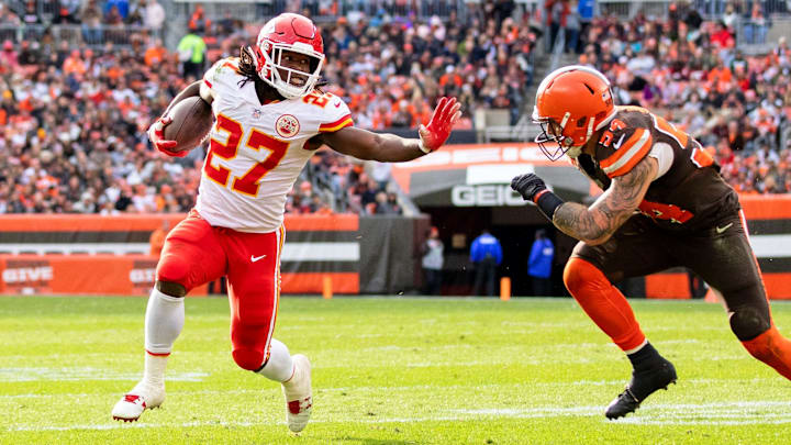 Nov 4, 2018; Cleveland, OH, USA; Kansas City Chiefs running back Kareem Hunt (27) pushes Cleveland Browns linebacker Tanner Vallejo (54) away as he runs the ball for a touchdown during the third quarter at FirstEnergy Stadium. Mandatory Credit: Scott R. Galvin-Imagn Images