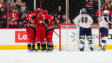 Jan 23, 2025; Raleigh, North Carolina, USA;  Carolina Hurricanes center Seth Jarvis (24) celebrates his goal with  center Martin Necas (88) and right wing Andrei Svechnikov (37) against the Columbus Blue Jackets during the second period at Lenovo Center. Mandatory Credit: James Guillory-Imagn Images