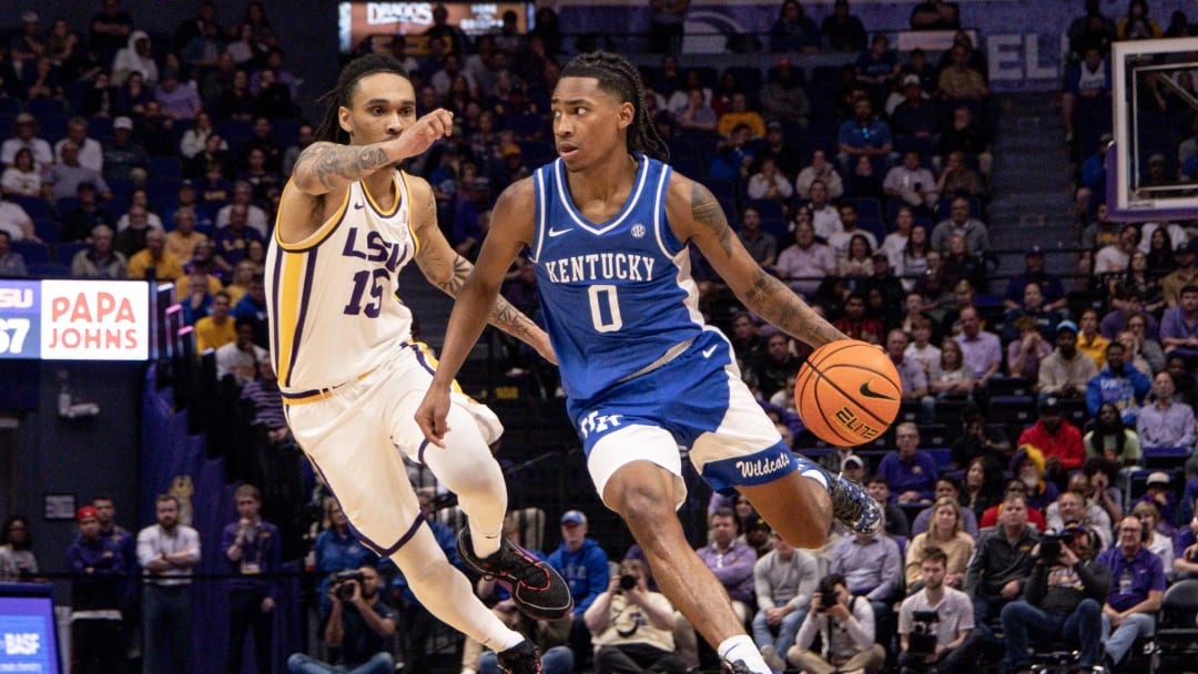 Feb 21, 2024; Baton Rouge, Louisiana, USA; Kentucky Wildcats guard Rob Dillingham (0) dribbles against LSU Tigers forward Tyrell Ward (15) during the second half of the game at Pete Maravich Assembly Center. Mandatory Credit: Stephen Lew-USA TODAY Sports