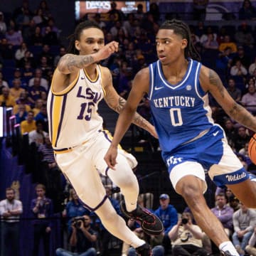 Feb 21, 2024; Baton Rouge, Louisiana, USA; Kentucky Wildcats guard Rob Dillingham (0) dribbles against LSU Tigers forward Tyrell Ward (15) during the second half of the game at Pete Maravich Assembly Center. Mandatory Credit: Stephen Lew-USA TODAY Sports