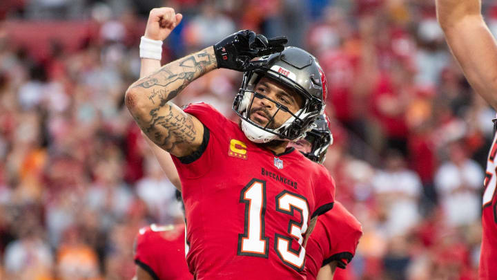 Dec 24, 2023; Tampa, Florida, USA; Tampa Bay Buccaneers wide receiver Mike Evans (13) celebrates the touchdown against the Jacksonville Jaguars in the second quarter at Raymond James Stadium. Mandatory Credit: Jeremy Reper-USA TODAY Sports