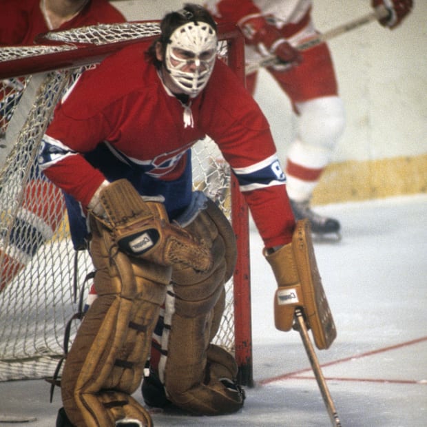 Hockey goalie in red uniform