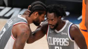 Los Angeles, California, USA; LA Clippers guard Paul George (13) and LA Clippers guard Patrick Beverley (21) talk during the second half of game four of the Western Conference Finals for the 2021 NBA Playoffs against the Phoenix Suns at Staples Center. Mandatory Credit: