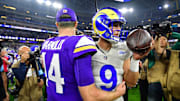 Oct 24, 2024; Inglewood, California, USA; Minnesota Vikings quarterback Sam Darnold (14) meets with Los Angeles Rams quarterback Matthew Stafford (9) following the game at SoFi Stadium. 