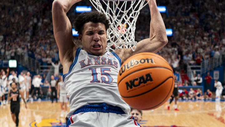 Feb 3, 2024; Lawrence, Kansas, USA; Kansas Jayhawks guard Kevin McCullar Jr. (15) dunks the ball during the first half against the Houston Cougars at Allen Fieldhouse. Mandatory Credit: Jay Biggerstaff-USA TODAY Sports