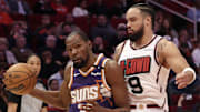 Feb 12, 2025; Houston, Texas, USA; Phoenix Suns forward Kevin Durant (35) dribbles against Houston Rockets forward Dillon Brooks (9) in the first quarter at Toyota Center. Mandatory Credit: Thomas Shea-Imagn Images