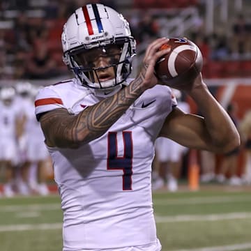 Sep 28, 2024; Salt Lake City, Utah, USA; Arizona Wildcats wide receiver Tetairoa McMillan (4) warms up before a game against the Utah Utes at Rice-Eccles Stadium.