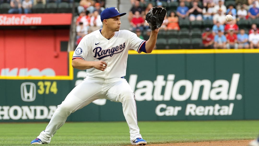 Apr 7, 2026; Arlington, Texas, USA; Texas Rangers shortstop Corey Seager (5) fields a ball during the first inning against the Seattle Mariners at Globe Life Field. Mandatory Credit: Kevin Jairaj-Imagn Images