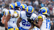 Nov 30, 2025; Charlotte, North Carolina, USA; Los Angeles Rams running back Blake Corum (22) celebrates after scoring a touchdown during the second quarter against the Carolina Panthers at Bank of America Stadium. Mandatory Credit: Jim Dedmon-Imagn Images