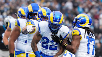 Nov 30, 2025; Charlotte, North Carolina, USA; Los Angeles Rams running back Blake Corum (22) celebrates after scoring a touchdown during the second quarter against the Carolina Panthers at Bank of America Stadium. Mandatory Credit: Jim Dedmon-Imagn Images