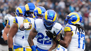 Nov 30, 2025; Charlotte, North Carolina, USA; Los Angeles Rams running back Blake Corum (22) celebrates after scoring a touchdown during the second quarter against the Carolina Panthers at Bank of America Stadium. Mandatory Credit: Jim Dedmon-Imagn Images