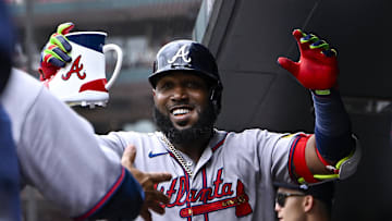 Jul 12, 2025; St. Louis, Missouri, USA;  Atlanta Braves designated hitter Marcell Ozuna (20) celebrates in the dugout after hitting a solo home run against the St. Louis Cardinals during the second inning at Busch Stadium. Mandatory Credit: Jeff Curry-Imagn Images