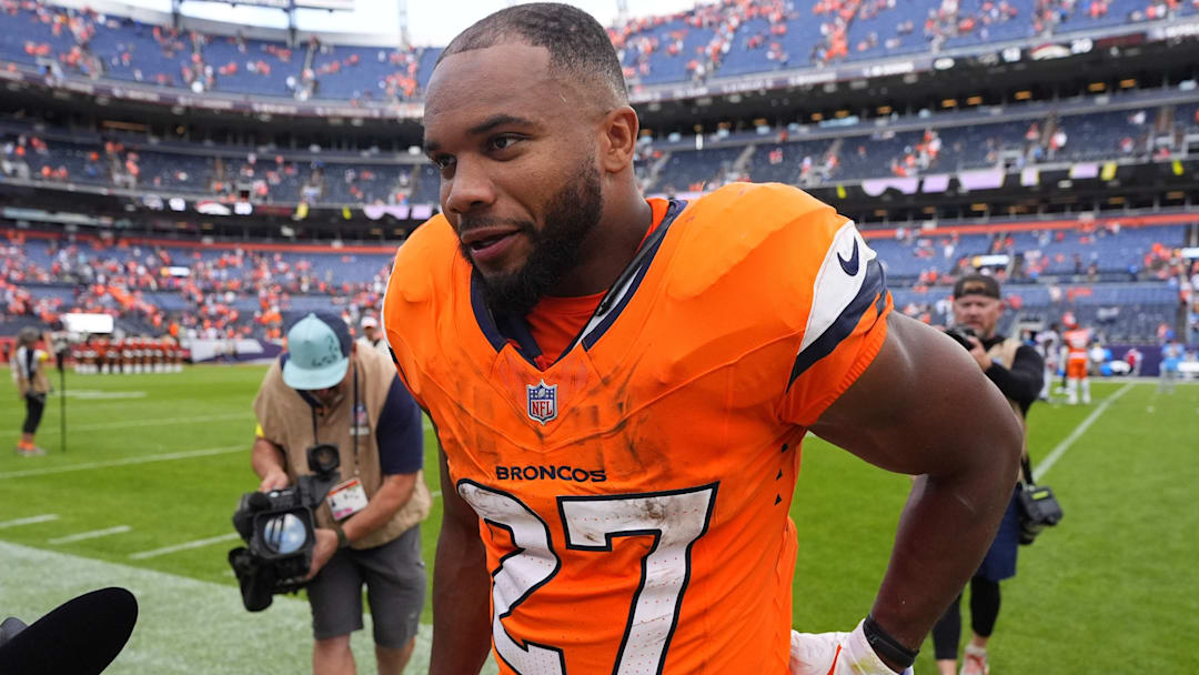 Sep 7, 2025; Denver, Colorado, USA; Denver Broncos running back J.K. Dobbins (27) after the game at Empower Field at Mile High. 
