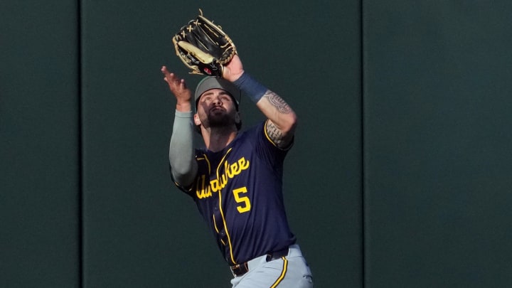 Mar 17, 2024; Surprise, Arizona, USA; Milwaukee Brewers center fielder Garrett Mitchell (5) catches a fly ball against the Kansas City Royals during the second inning at Surprise Stadium. Mandatory Credit: Joe Camporeale-USA TODAY Sports