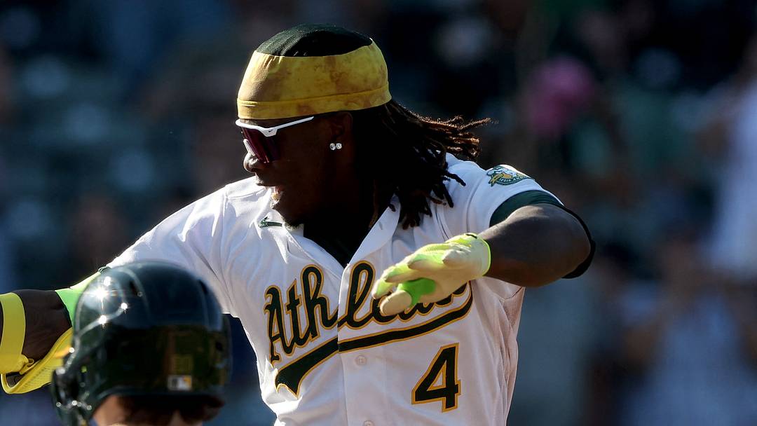 Sep 13, 2026; West Sacramento, California, USA;  Athletics right fielder Lawrence Butler (4) leaps into the air before touching home plate after hitting a walk-off two-run home run against Seattle Mariners pitcher Andres Munoz (not pictured) during the ninth inning at Sutter Health Park.  Mandatory Credit: Dennis Lee-Imagn Images