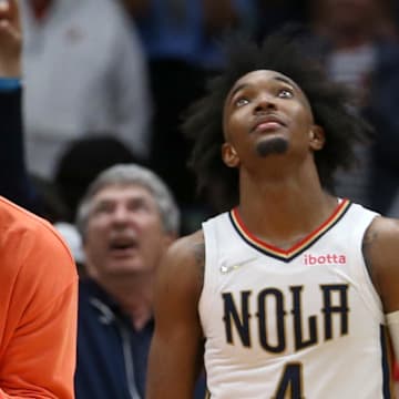 Mar 27, 2022; New Orleans, Louisiana, USA; New Orleans Pelicans forward Zion Williamson reacts to a play with guard Devonte' Graham (4) in the second half against the Los Angeles Lakers at the Smoothie King Center. The Pelicans won, 116-108. Mandatory Credit: Chuck Cook-Imagn Images