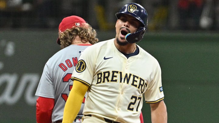 Sep 3, 2024; Milwaukee, Wisconsin, USA; Milwaukee Brewers shortstop Willy Adames (27) hits a double against the St. Louis Cardinals in the eleventh inning at American Family Field. Mandatory Credit: Michael McLoone-Imagn Images
