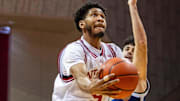Indiana's Kanaan Carlyle (9) scores past Chattanooga's Jack Kostel (11) during the Indiana versus Chattanooga men's basketball game at Simon Skjodt Assembly Hall on Saturday, Dec. 21, 2204.