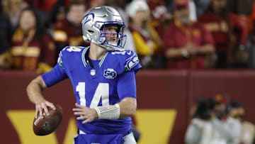 Nov 2, 2025; Landover, Maryland, USA; Seattle Seahawks quarterback Sam Darnold (14) throws the ball against the Washington Commanders during the first half at Northwest Stadium. Mandatory Credit: Amber Searls-Imagn Images