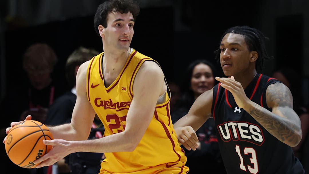 Feb 24, 2026; Salt Lake City, Utah, USA; Iowa State Cyclones forward Milan Momcilovic (22) posts up against Utah Utes forward Kendyl Sanders (13) during the second half at Jon M. Huntsman Center.