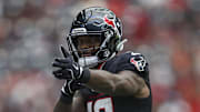 Aug 17, 2024; Houston, Texas, USA; Houston Texans wide receiver Nico Collins (12) signals after a first down during the game during the game against the New York Giants at NRG Stadium. Mandatory Credit: Troy Taormina-Imagn Images