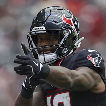 Aug 17, 2024; Houston, Texas, USA; Houston Texans wide receiver Nico Collins (12) signals after a first down during the game during the game against the New York Giants at NRG Stadium. Mandatory Credit: Troy Taormina-Imagn Images