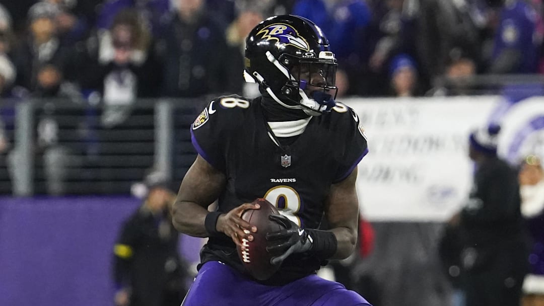 Dec 21, 2025; Baltimore, Maryland, USA;  Baltimore Ravens quarterback Lamar Jackson (8) looks to pass against the New England Patriots during the first quarter of the game at M&T Bank Stadium. Mandatory Credit: James Lang-Imagn Images