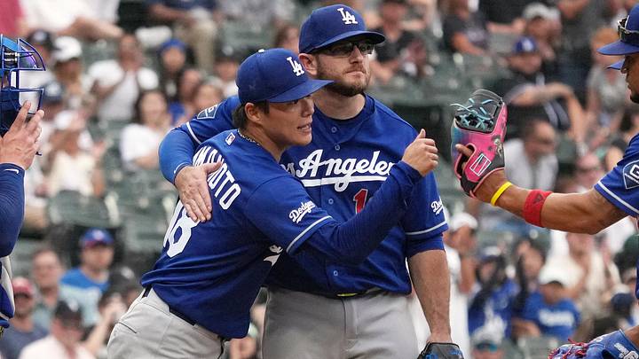 Jun 13, 2026; Chicago, Illinois, USA; Los Angeles Dodgers pitcher Yoshinobu Yamamoto (18) and third baseman Max Muncy (13) hug after Yamamoto leaves the game against the Chicago White Sox during the ninth inning at Rate Field. Mandatory Credit: David Banks-Imagn Images