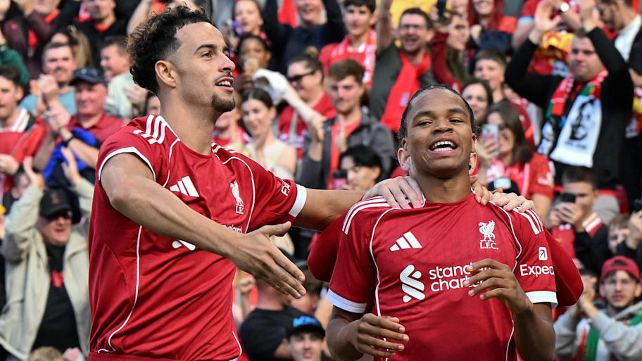 Curtis Jones (left) making sure the Anfield crowd acknowledged Rio Ngumoha’s performance. | IMAGO/Sportimage