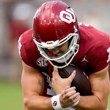 Oklahoma quarterback Jackson Arnold (11) braces for a hit after running the ball in the first half of an NCAA football game between Oklahoma (OU) and Temple at the Gaylord Family Oklahoma Memorial Stadium in Norman, Okla., on Friday, Aug. 30, 2024.