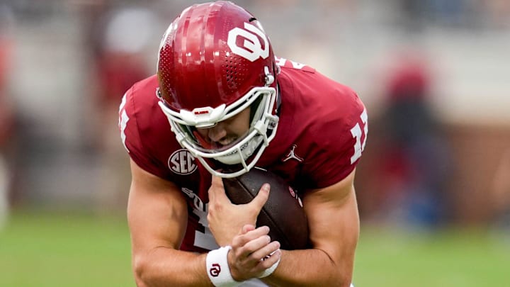 Oklahoma quarterback Jackson Arnold (11) braces for a hit after running the ball in the first half of an NCAA football game between Oklahoma (OU) and Temple at the Gaylord Family Oklahoma Memorial Stadium in Norman, Okla., on Friday, Aug. 30, 2024.