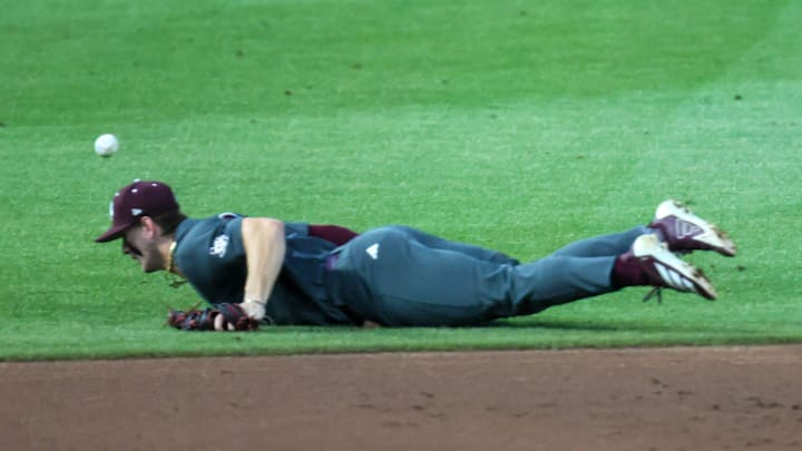 A infield hit gets by Texas A&M infielder Boston Kellner (6) during an NCAA baseball game at Condron Family Ballpark at Alfred A. McKethan Field in Gainesville, FL on Friday, April 24, 2026. [Alan Youngblood/Gainesville Sun]