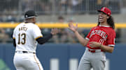 May 7, 2024; Pittsburgh, Pennsylvania, USA; Los Angeles Angels third baseman Cole Tucker (8) reacts as he greets Pittsburgh Pirates third baseman Ke'Bryan Hayes (13) before their game at PNC Park. 