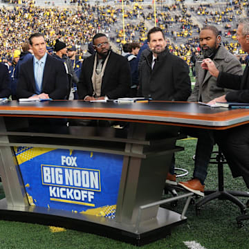 Nov 25, 2023; Ann Arbor, Michigan, USA; Former Ohio State head coach Urban Meyer talks on the sideline set of Fox Big Noon Kickoff prior to the NCAA football game between the Michigan Wolverines and the Ohio State Buckeyes at Michigan Stadium.