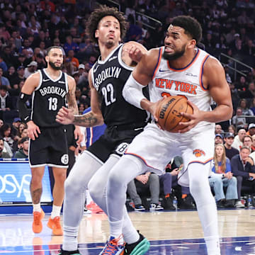 Nov 9, 2025; New York, New York, USA;  New York Knicks center Karl-Anthony Towns (32) looks to post up against Brooklyn Nets forward Jalen Wilson (22) in the second quarter at Madison Square Garden. Mandatory Credit: Wendell Cruz-Imagn Images