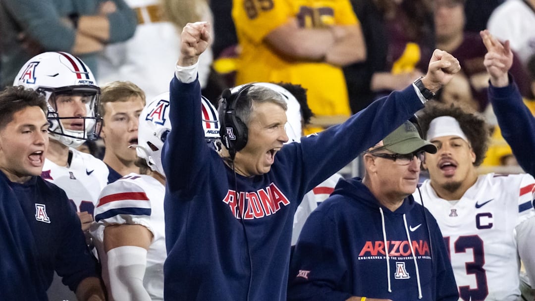 Nov 28, 2025; Tempe, Arizona, USA; Arizona Wildcats head coach Brent Brennan celebrates against the Arizona State Sun Devils in the second half during the 99th Territorial Cup at Mountain America Stadium. Mandatory Credit: Mark J. Rebilas-Imagn Images