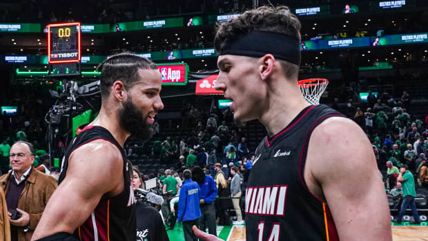 Apr 24, 2024; Boston, Massachusetts, USA; Miami Heat guard Tyler Herro (14) and forward Caleb Martin (16) react after defeating the Boston Celtics in game two of the first round for the 2024 NBA playoffs at TD Garden. Mandatory Credit: David Butler II-USA TODAY Sports