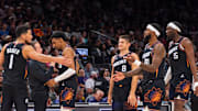 Nov 2, 2025; Phoenix, Arizona, USA; Phoenix Suns guard Devin Booker (1), forward Ryan Dunn (0), Coach Jordan Ott, guard Grayson Allen (8), forward Royce O'Neale (00) and center Mark Williams (15) celebrate during a time-out in the second half against the San Antonio Spurs at Mortgage Matchup Center. Mandatory Credit: Allan Henry-Imagn Images