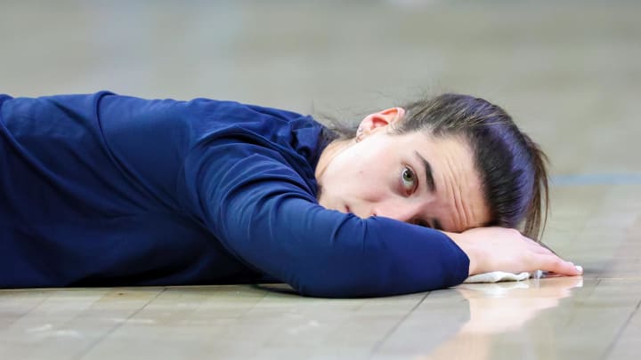 Jul 17, 2024; Arlington, Texas, USA; Indiana Fever guard Caitlin Clark (22) stretches before the game against the Dallas Wings at College Park Center. Mandatory Credit: Kevin Jairaj-USA TODAY Sports