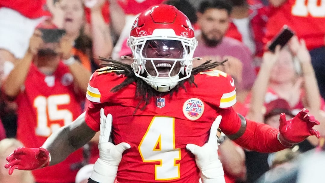 Aug 22, 2025; Kansas City, Missouri, USA; Kansas City Chiefs wide receiver Rashee Rice (4) celebrates with guard Trey Smith (65) after scoring against the Chicago Bears during the first half of the game at GEHA Field at Arrowhead Stadium. Mandatory Credit: Denny Medley-Imagn Images
